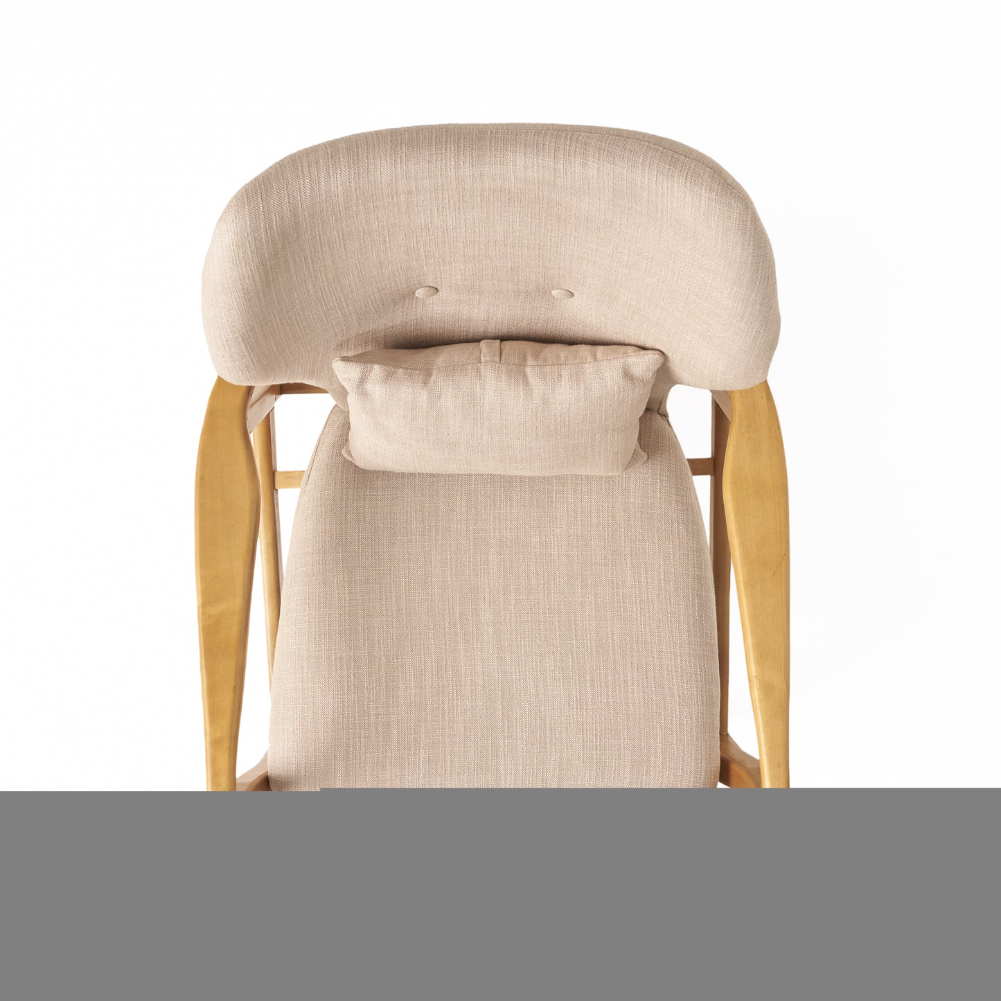 Textured beige upholstered accent chair with a lumbar pillow