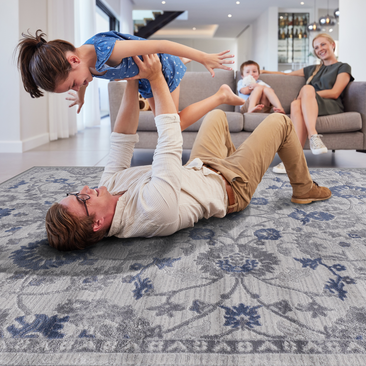 Distressed floral rug in grey and navy blue adds timeless elegance to living spaces