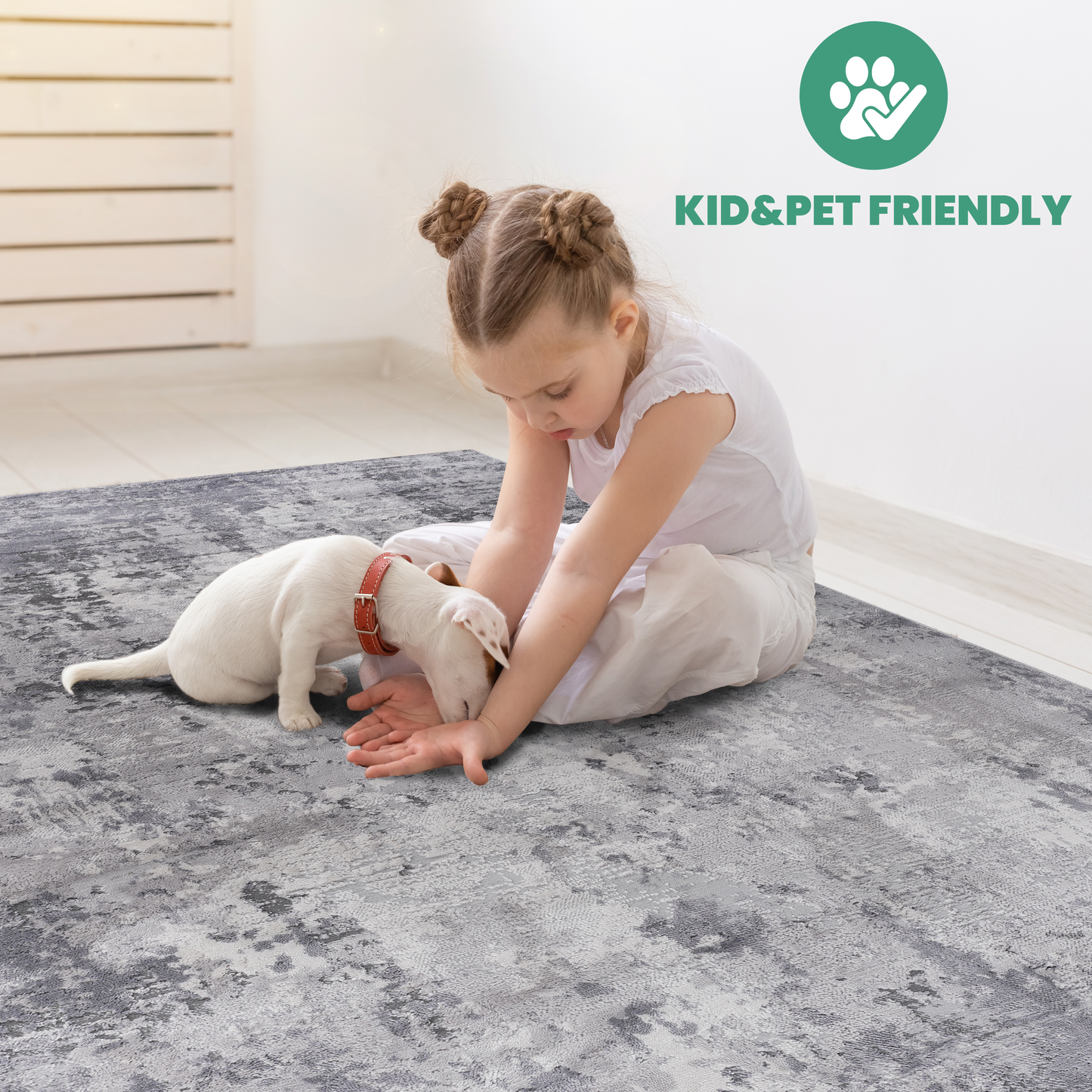 Grey abstract pattern rug with a child and puppy playing