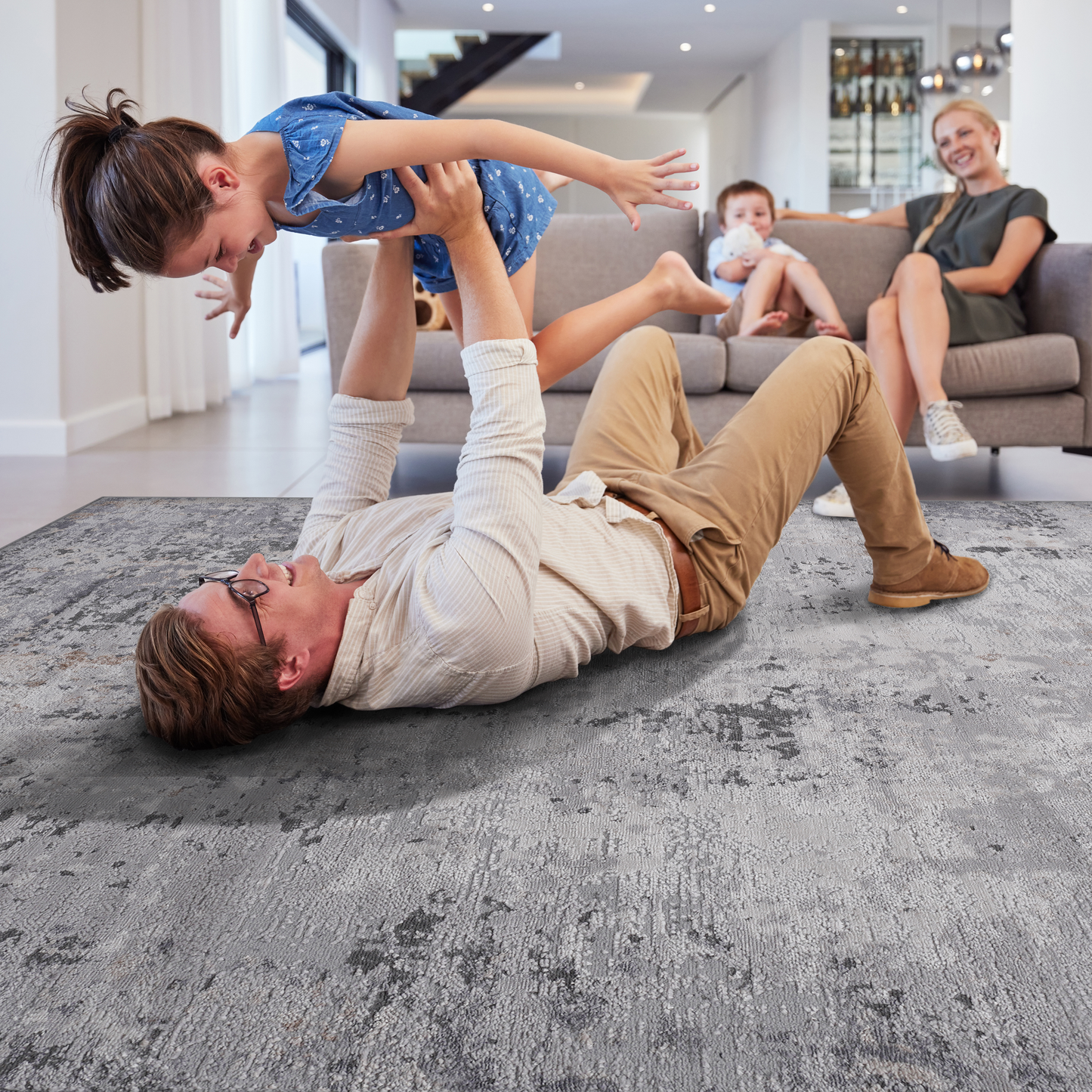 Abstract patterned grey area rug with distressed look