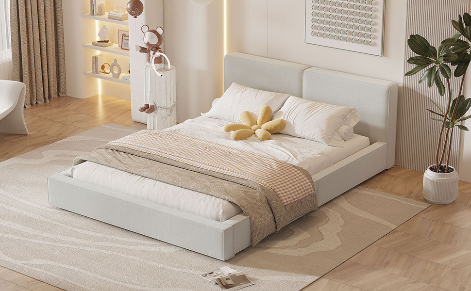 Modern white upholstered bed with soft bedding and a plaid throw blanket