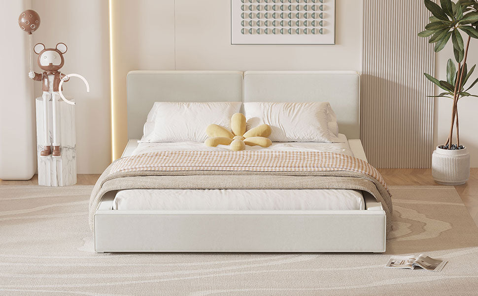 White upholstered kingsize bed with neutral bedding and a flower pillow