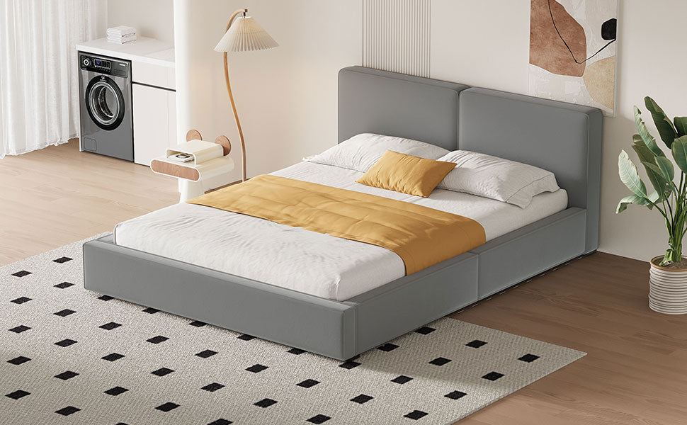 Modern grey upholstered platform bed with mustard throw