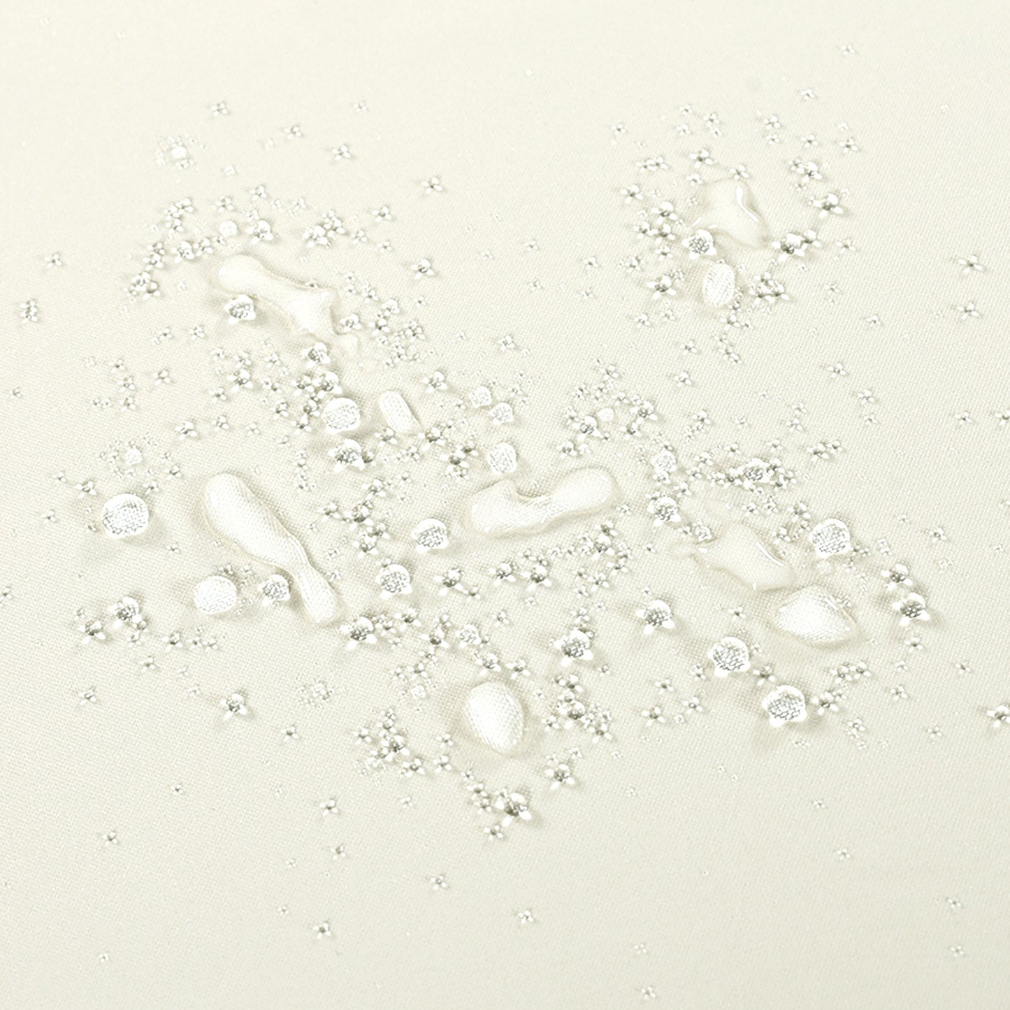 Light beige textured fabric with water beads showing its waterresistant quality