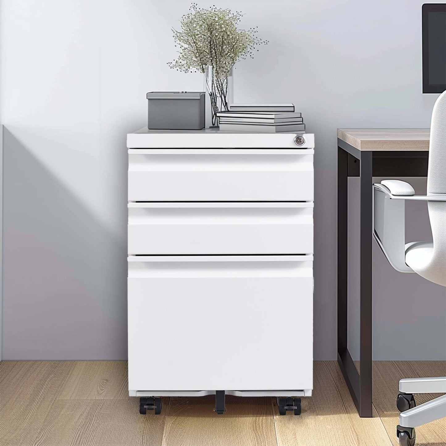 White metal mobile filing cabinet with three drawers and a lock
