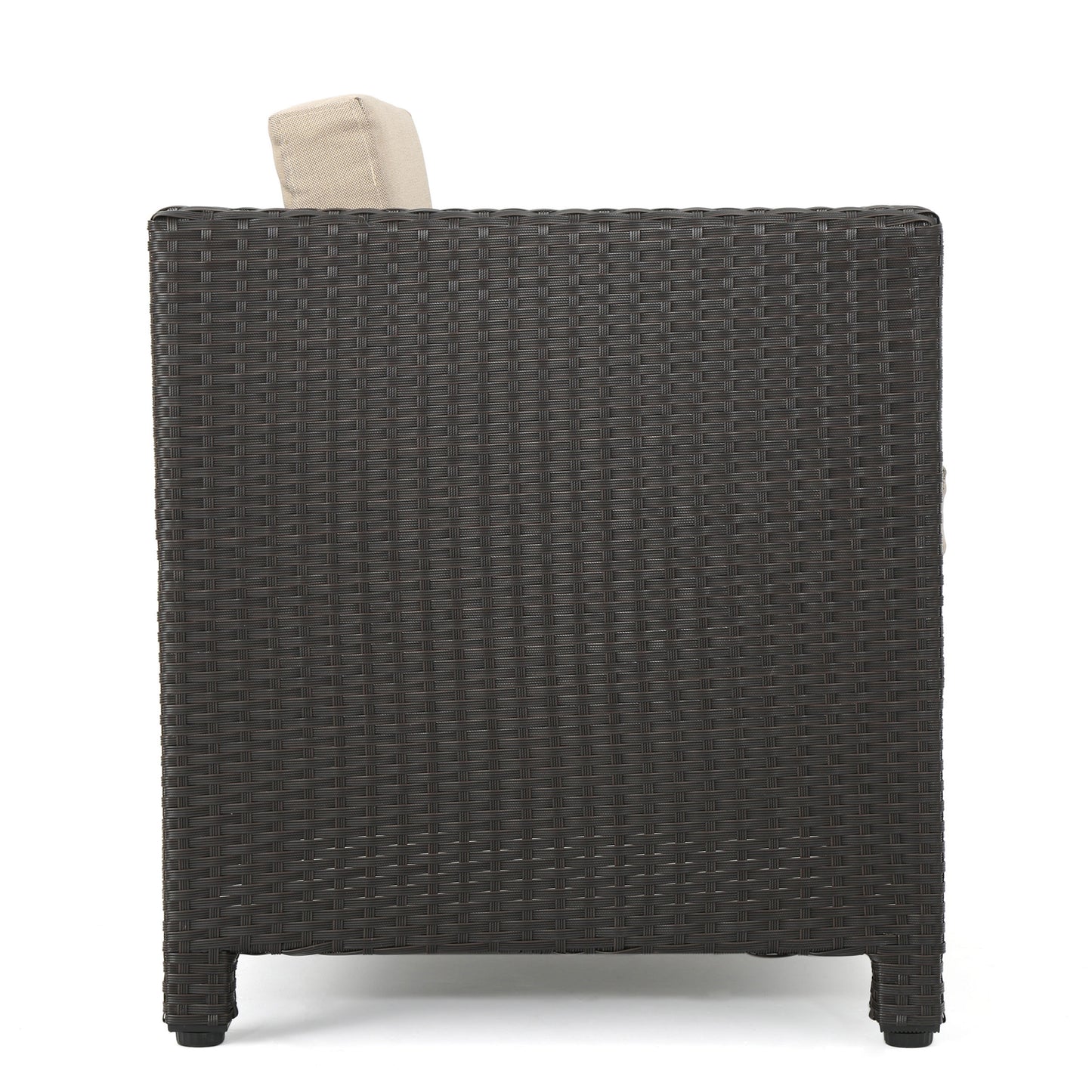 Dark brown wicker armchair side view with beige cushion peek