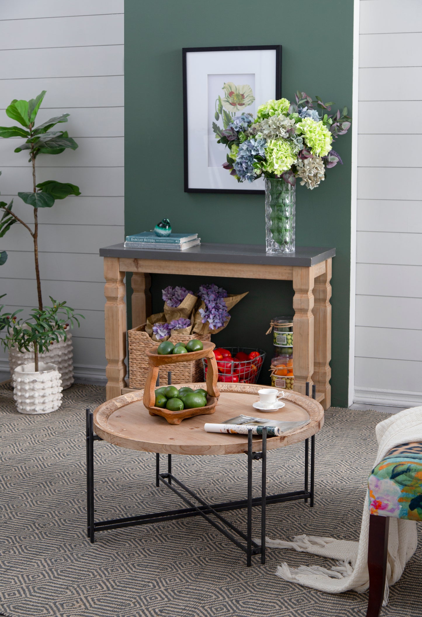 Wooden twotiered fruit basket with green limes perfect for kitchen countertop display