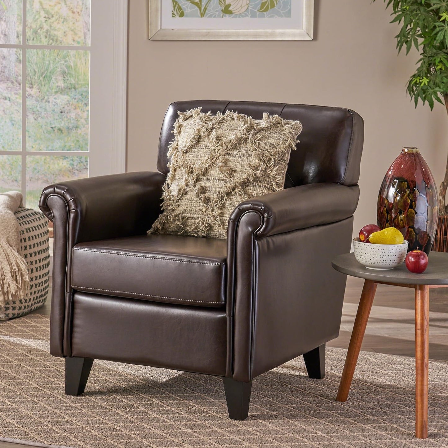 Dark brown leather accent chair with plush cushion and rolled arms