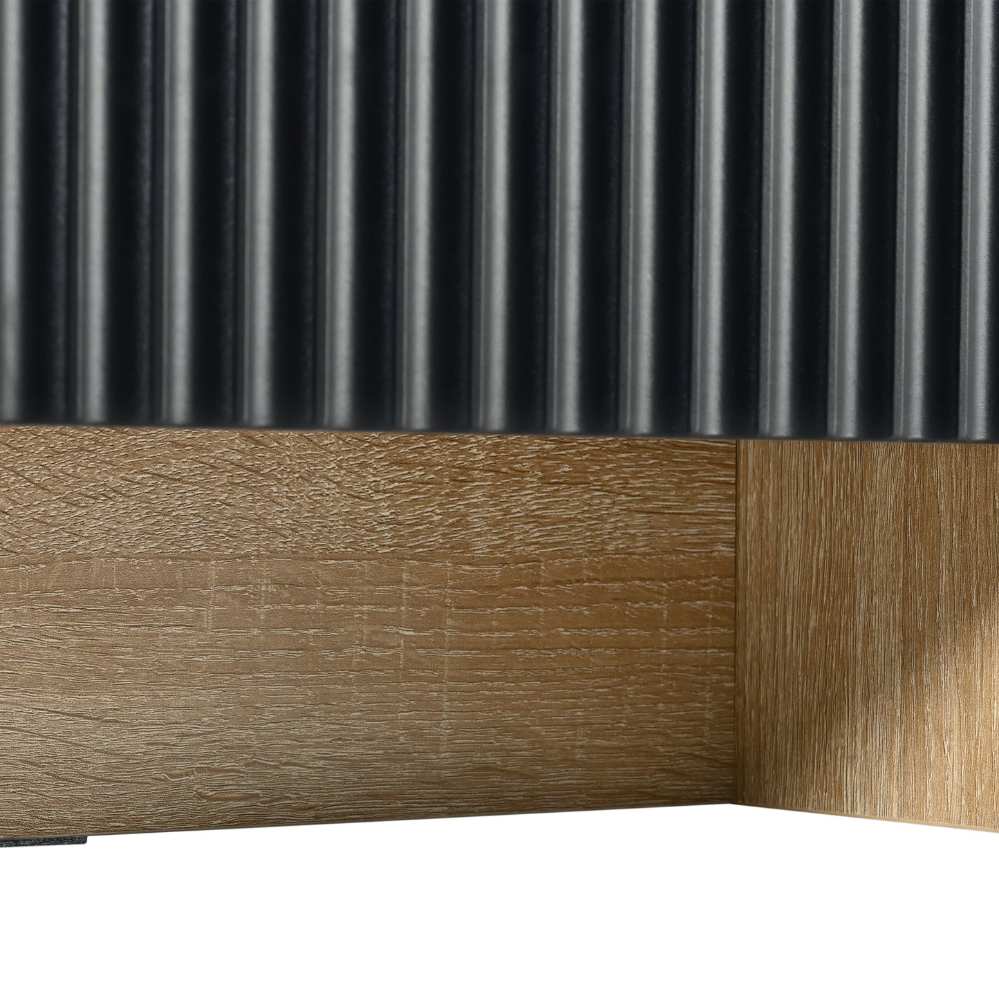 Textured black ribbed panel above a natural wood grain surface