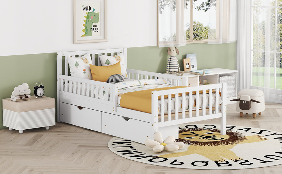 White wooden toddler bed with guardrail and storage drawers