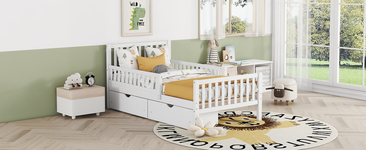 White toddler bed with drawers and playful bedding