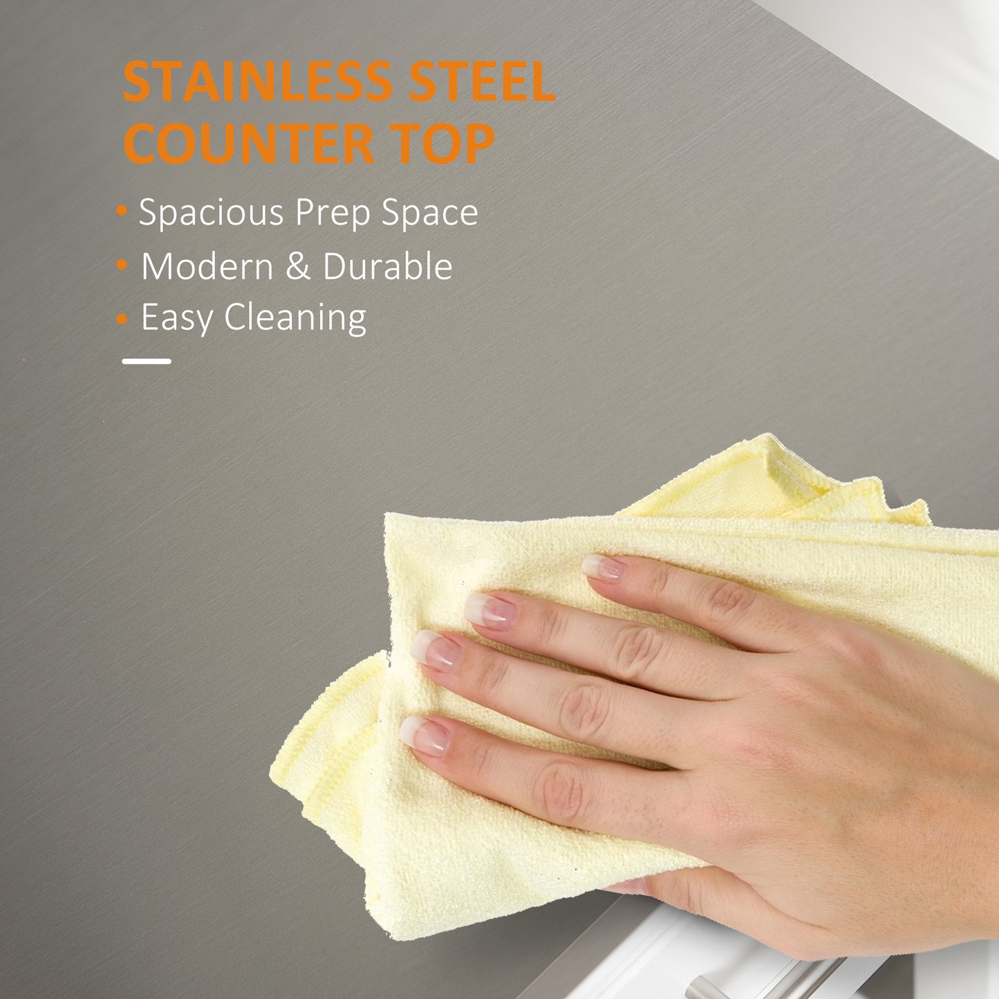Brushed stainless steel countertop being wiped clean with a yellow microfiber cloth