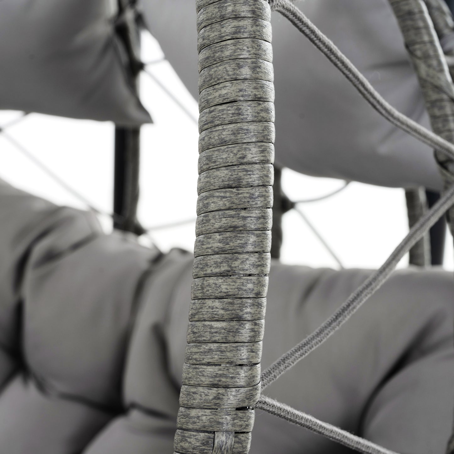 Close up of grey rattan weave on an outdoor chair showing texture
