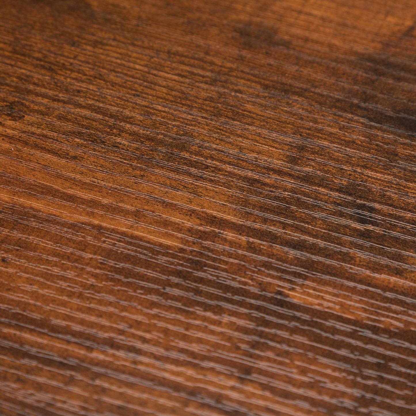Rich dark walnut wood grain texture closeup