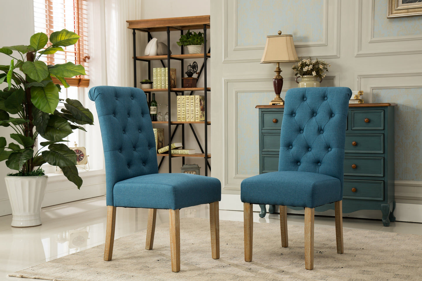 Tufted blue fabric dining chair with natural wood legs perfect for a modern farmhouse kitchen