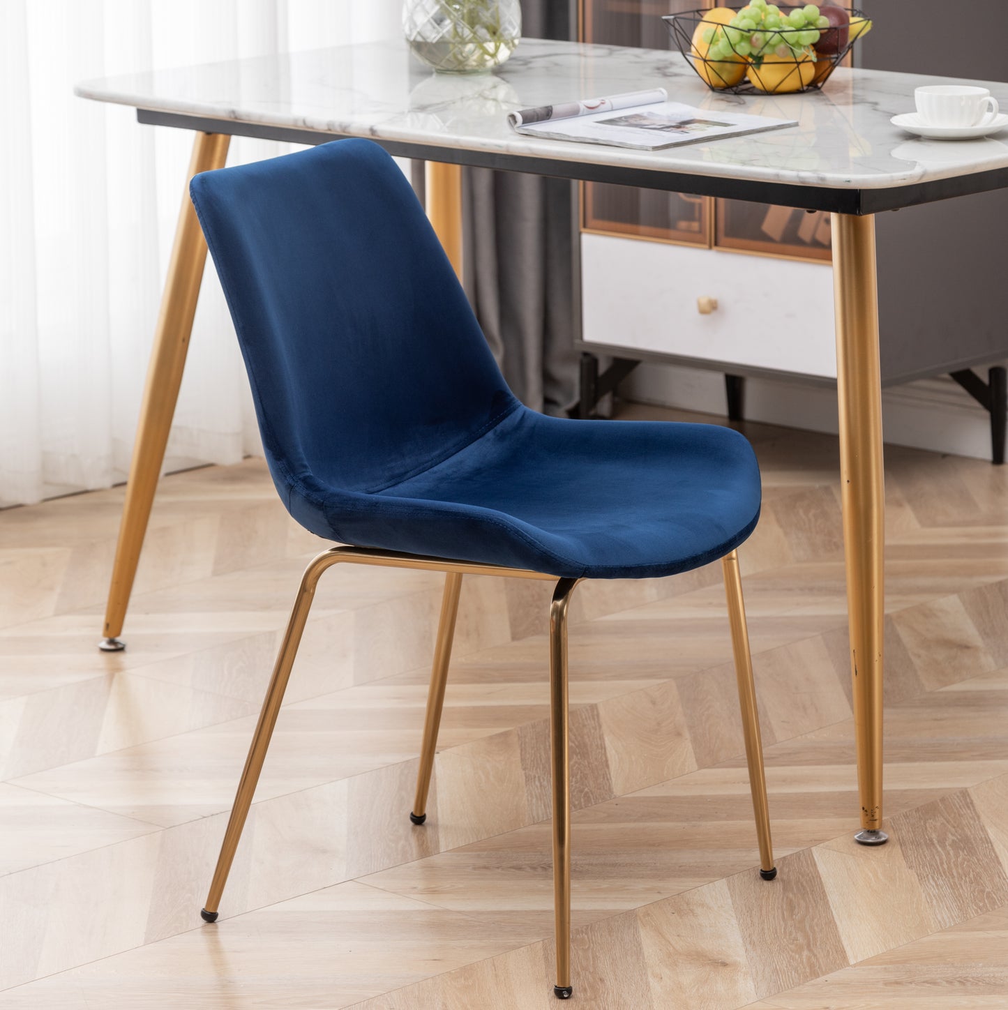 Elegant navy blue velvet dining chair with polished gold metal legs
