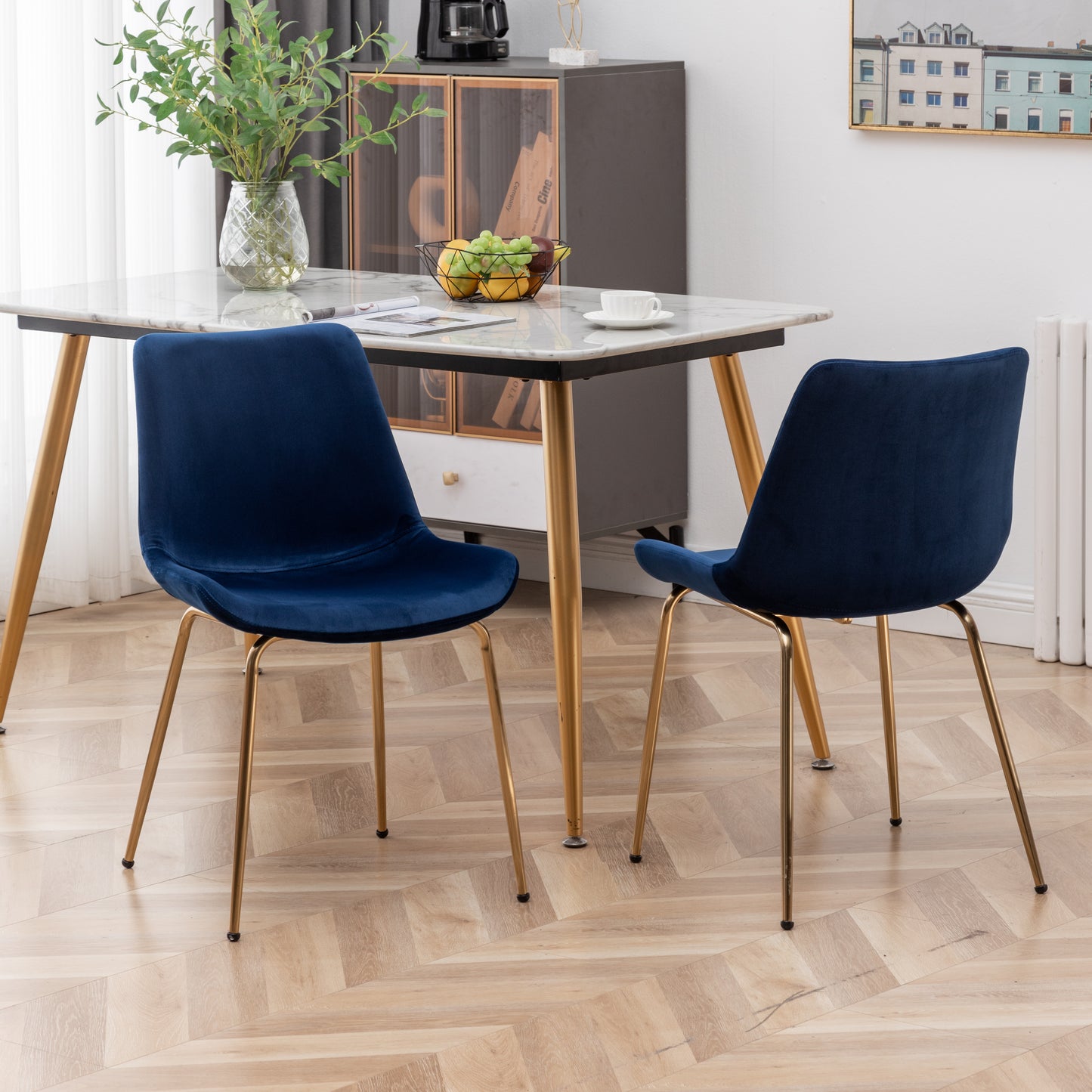 Plush navy velvet dining chair with elegant gold legs for modern homes