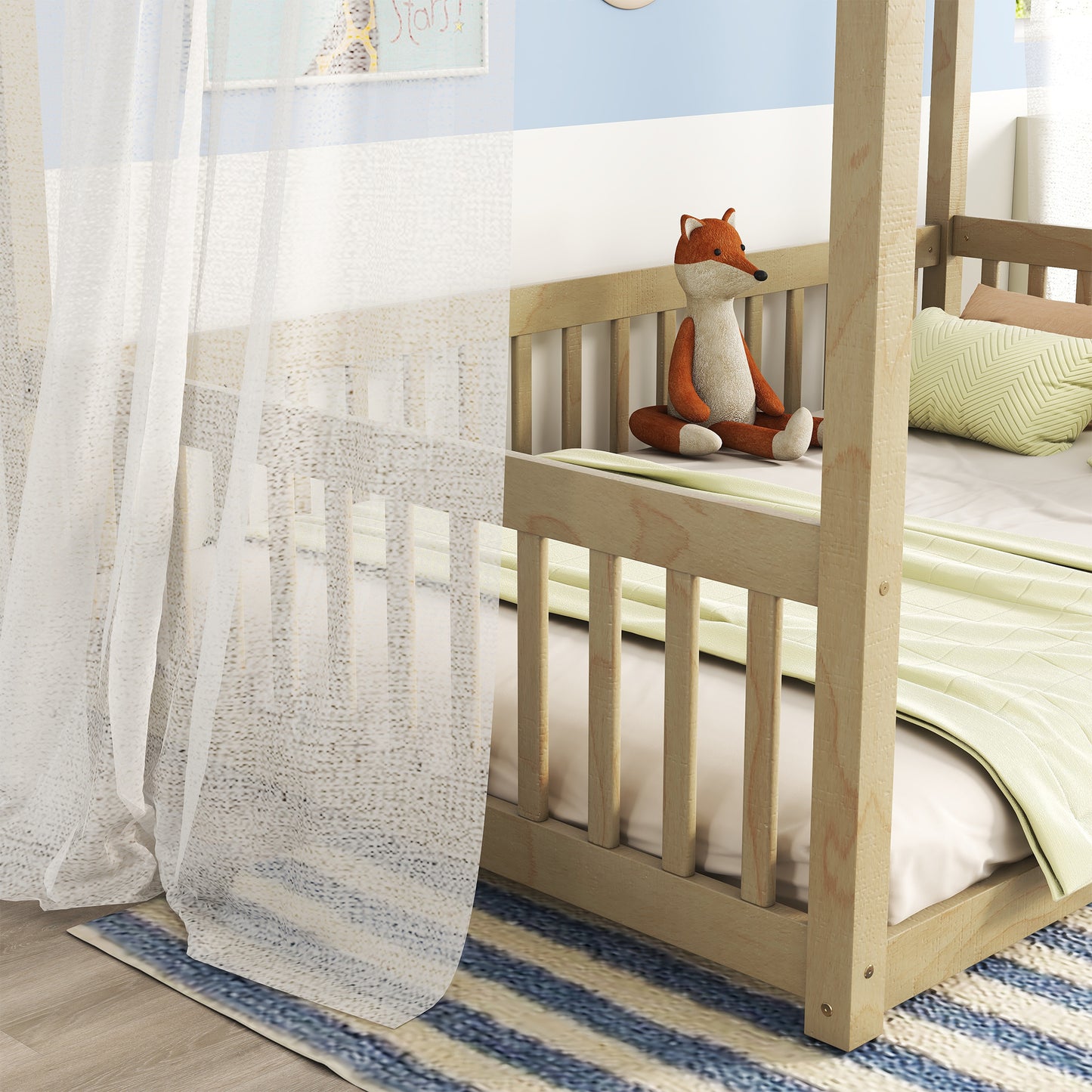 Natural wood crib with attached fox toy and light green blanket