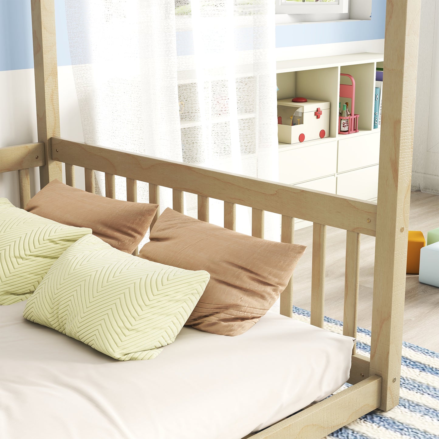 Natural wood toddler bed with pale green chevron and tan textured pillows