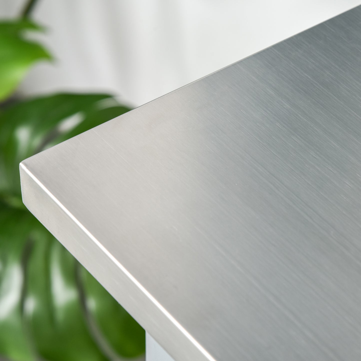 Brushed stainless steel countertop with rounded corner