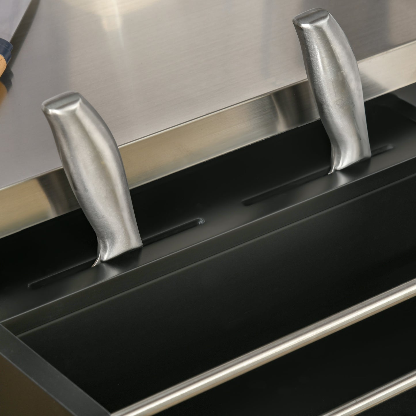 Stainless steel knife block organizer with two knives inserted
