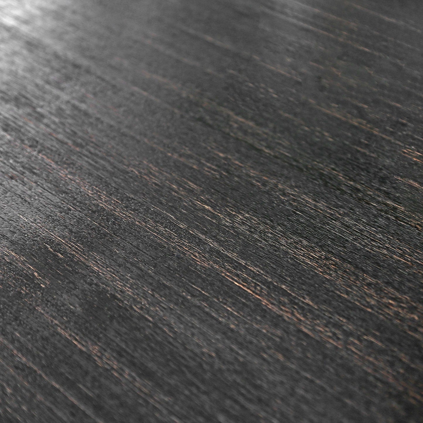 Dark wood grain texture closeup on distressed dark oak planks for flooring