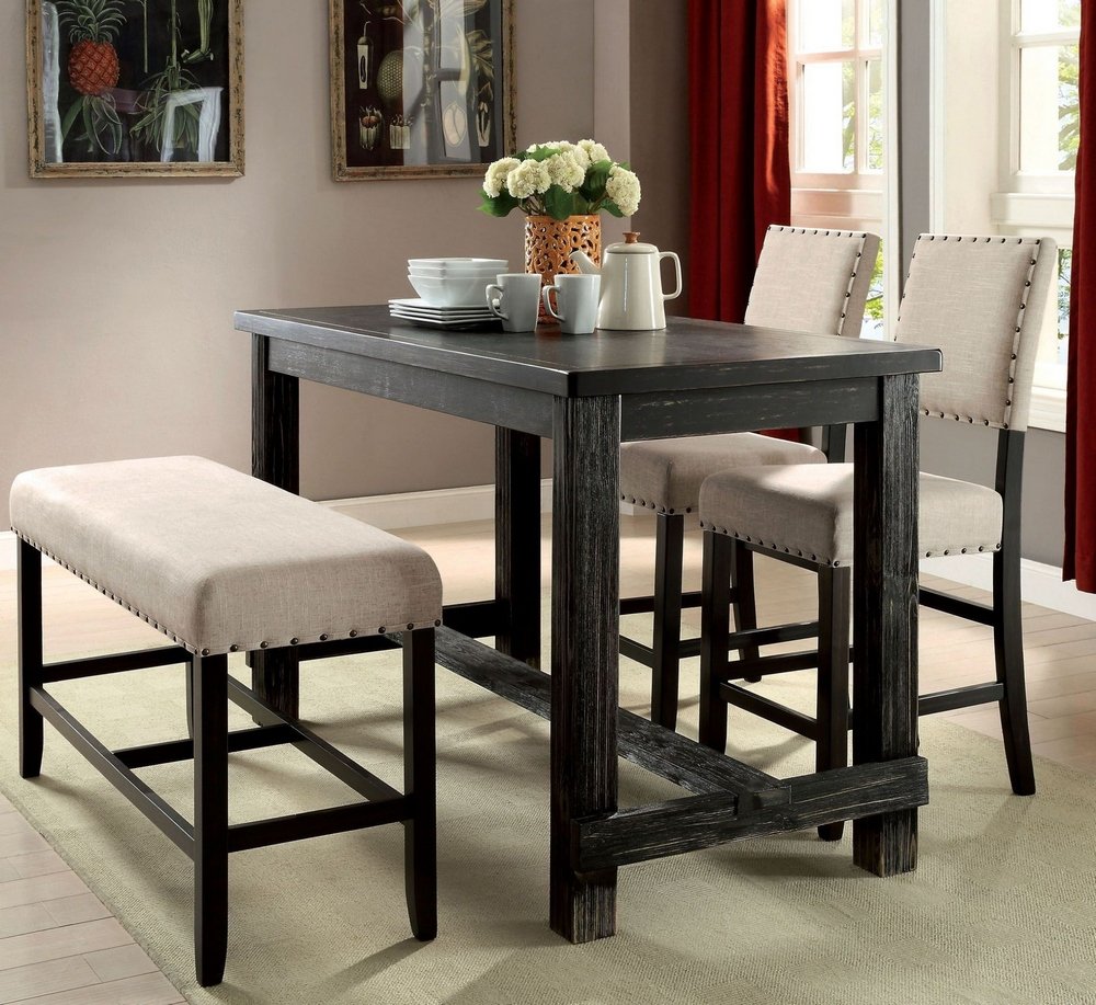 Dark wood farmhouse pub table with upholstered bench and stools