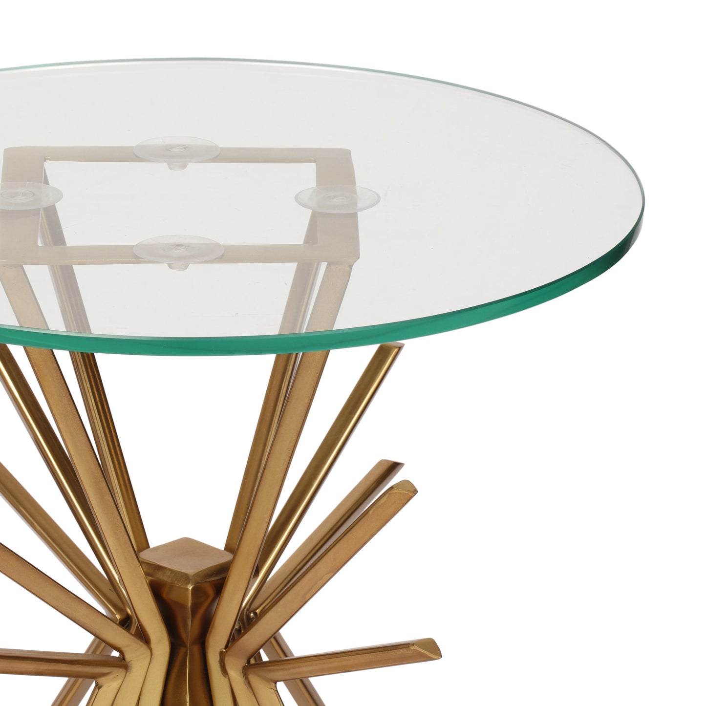 Gold starburst base side table with a round glass top and suction cups