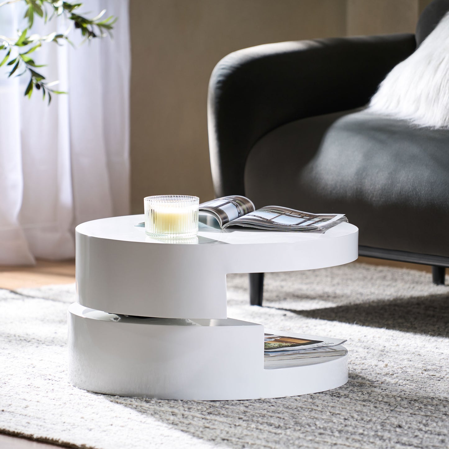 Modern white rotating side table with magazine storage