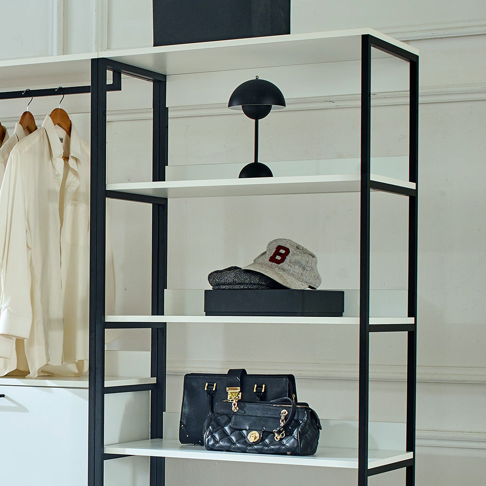 Cream linen shirts hanging on black metal shelf unit