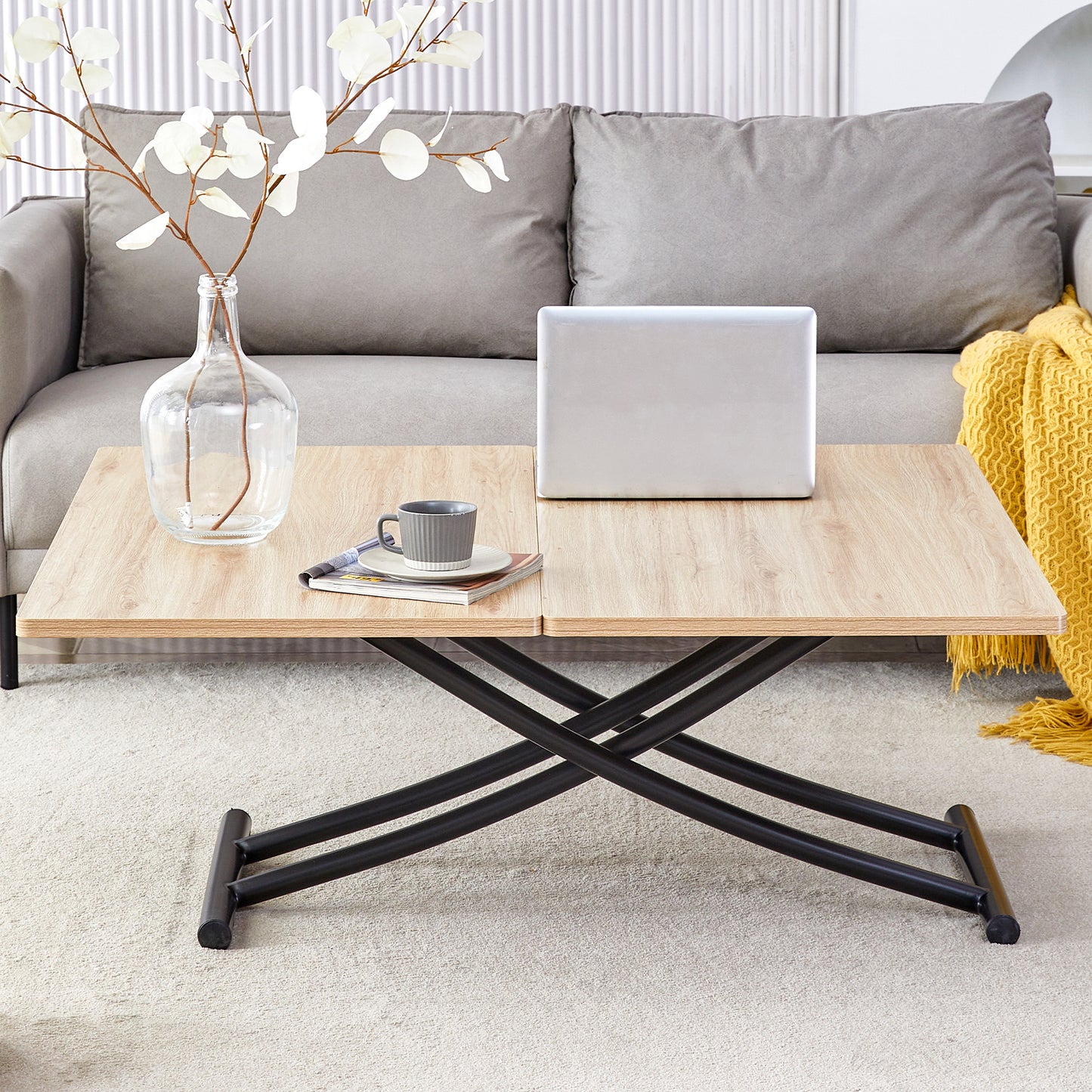 Lift top coffee table with light oak wood grain finish and black metal base