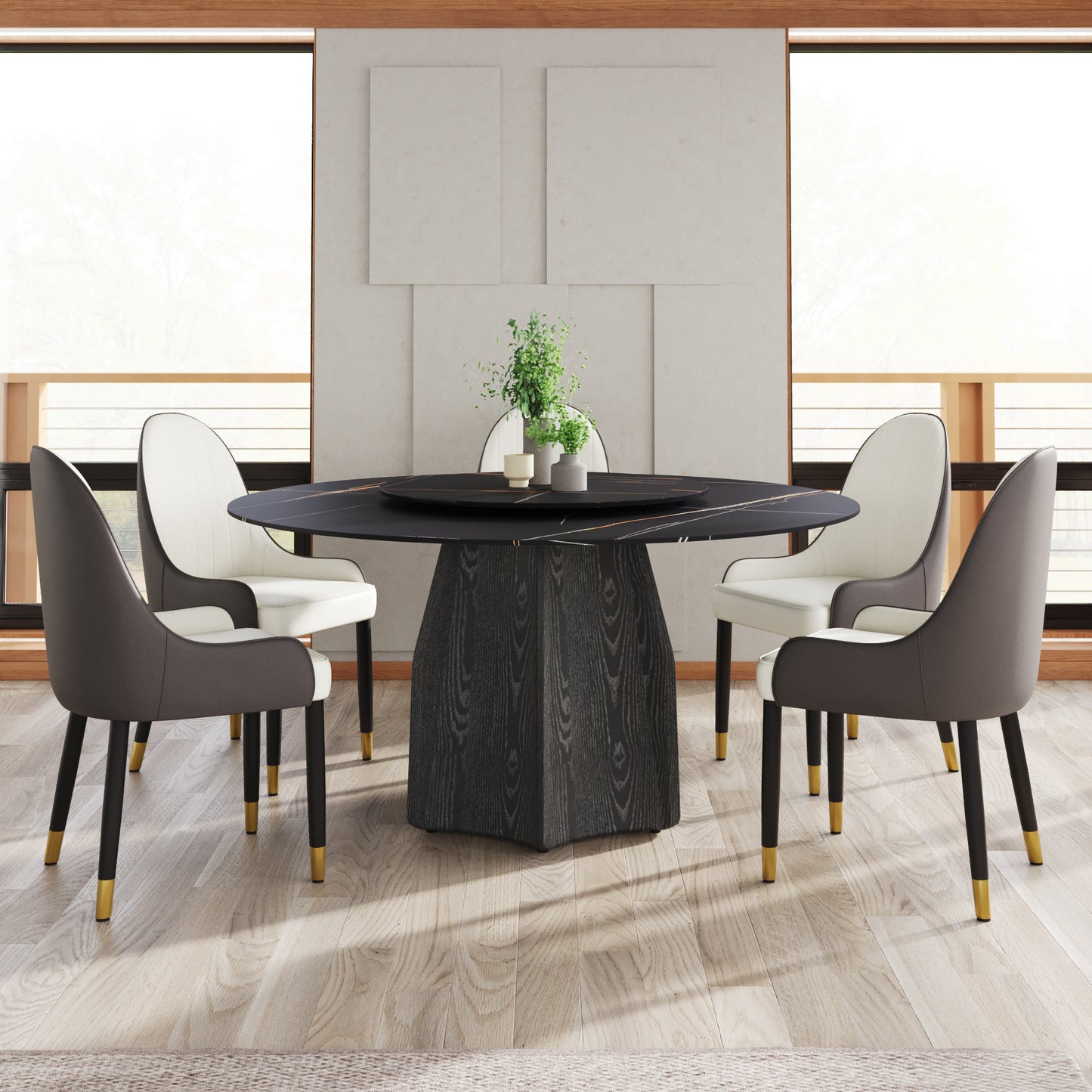 Round marble dining table with black wood pedestal base and gold accents