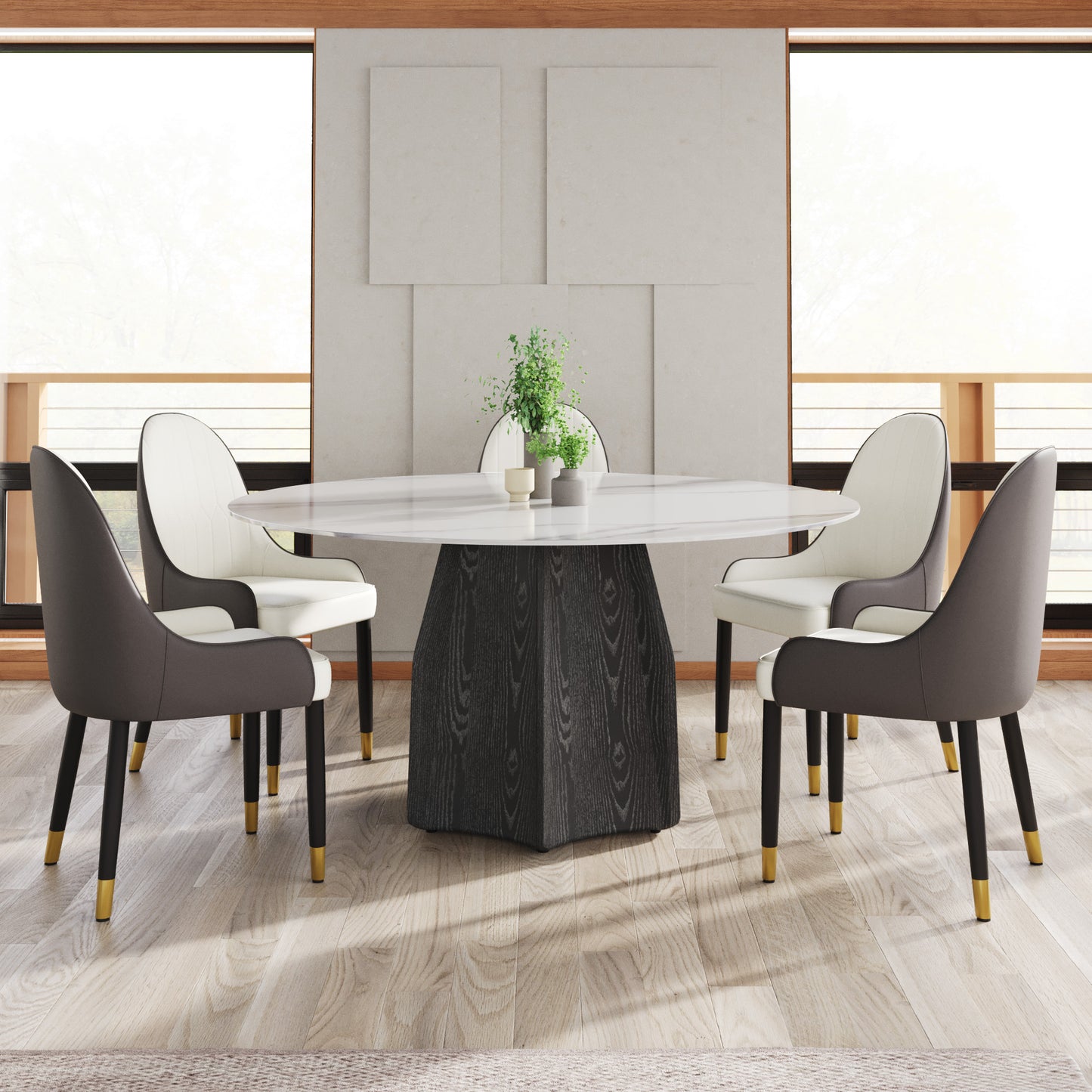White marble oval dining table with dark wood pedestal base and four upholstered chairs
