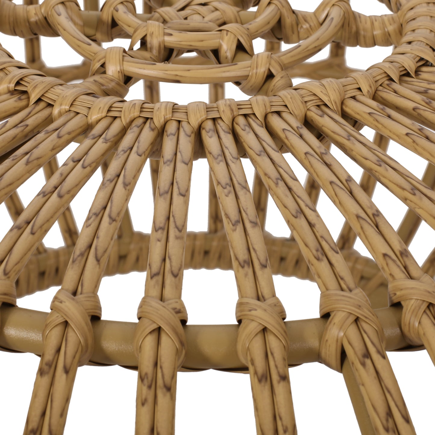 Detailed shot of intricately woven natural rattan stool base in warm beige tones