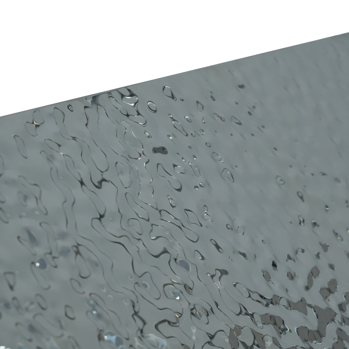 Textured silver metal sheet with organic wavy patterns
