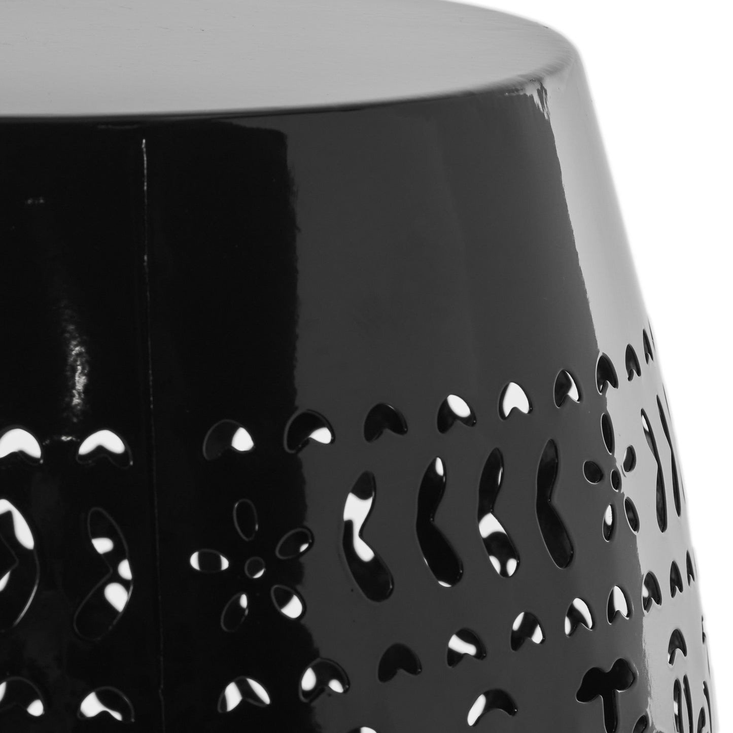 Glossy black metal garden stool with opencut floral pattern detailing