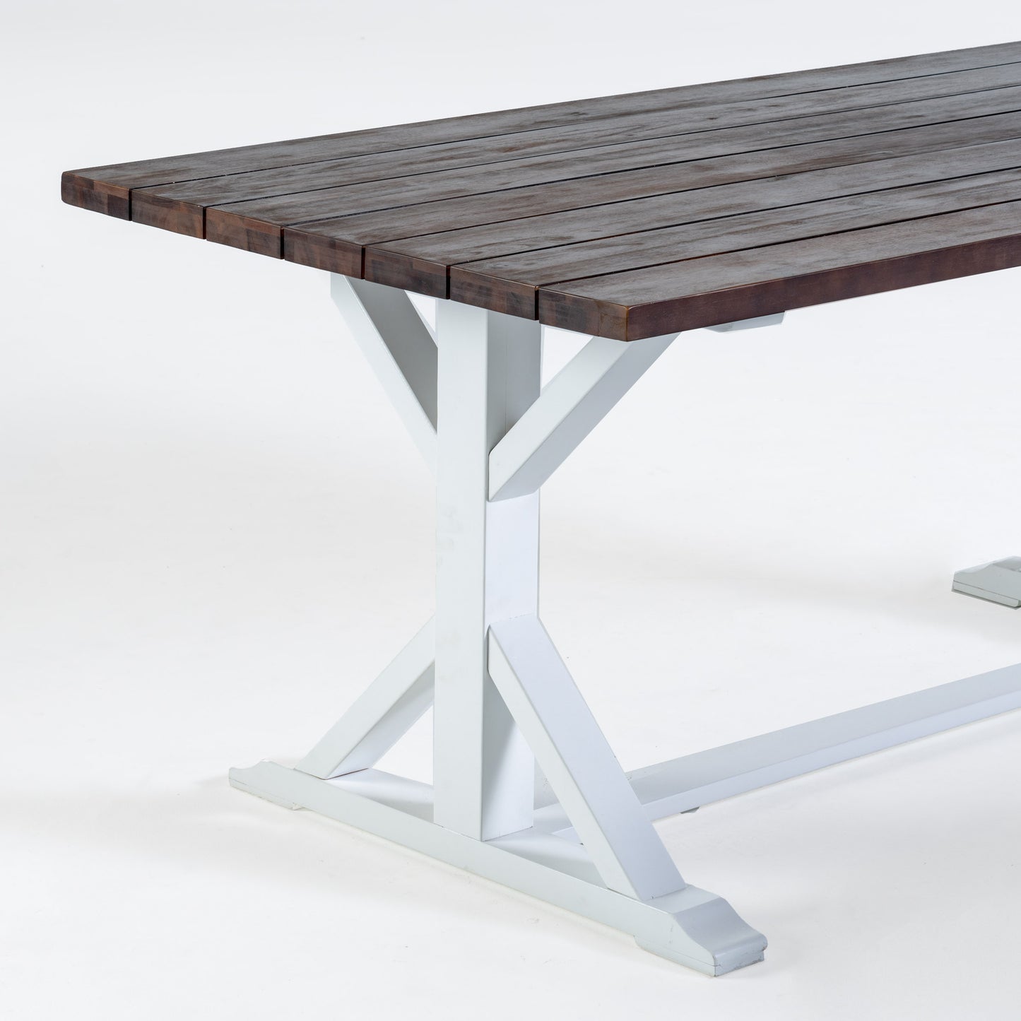 Dark wood slatted farmhouse dining table with white trestle legs
