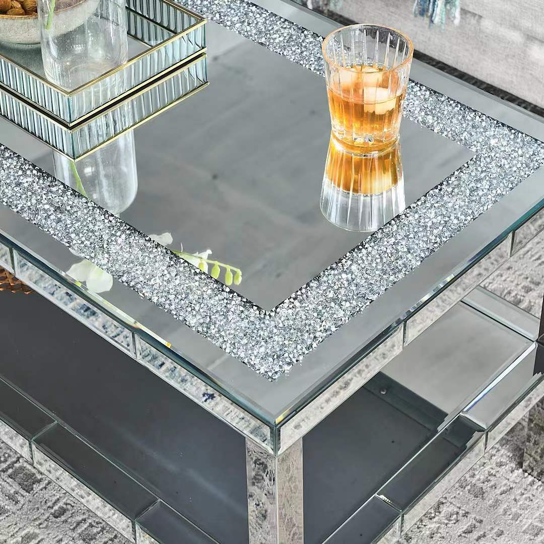 Mirrored coffee table with crushed diamond border and amber drink