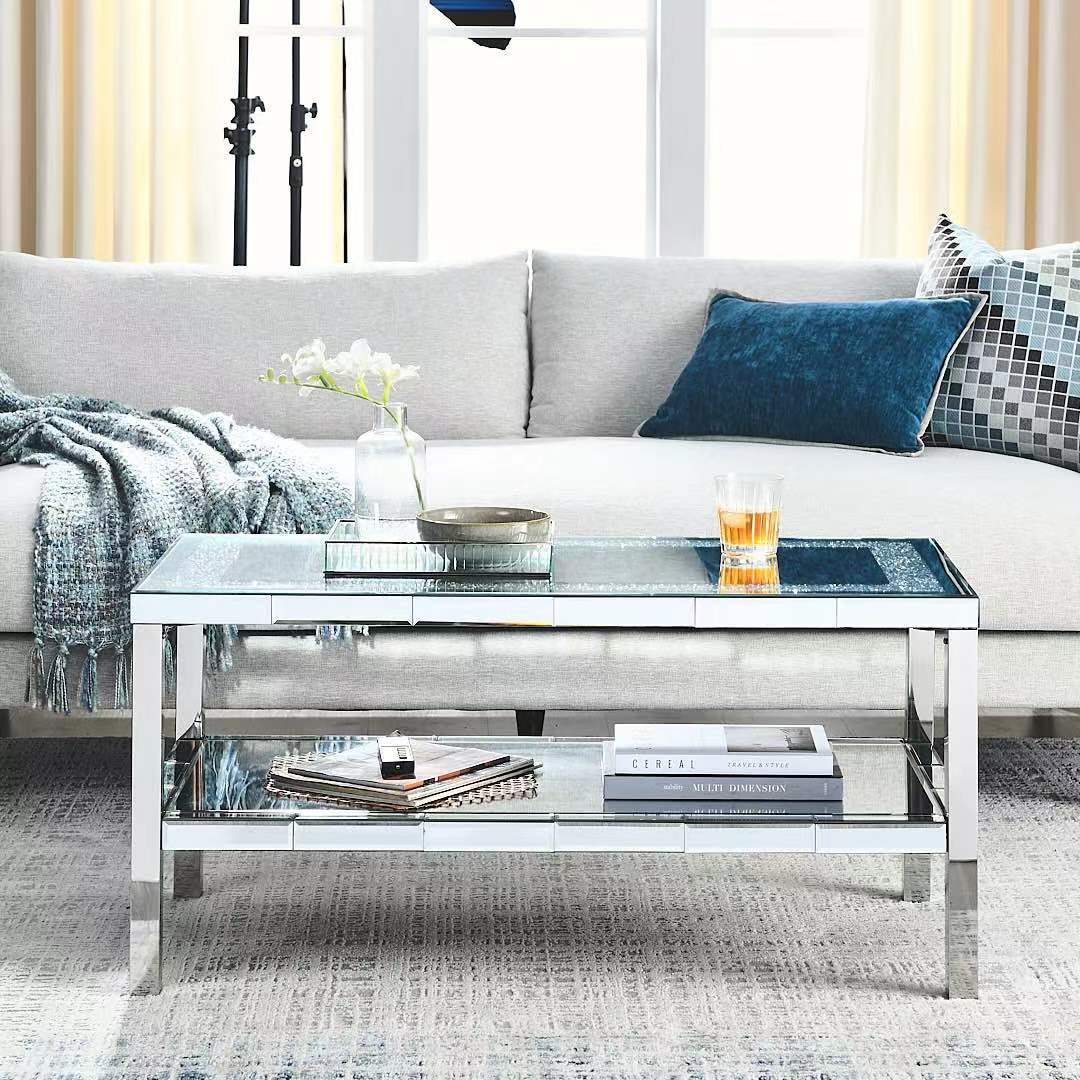 Mirrored coffee table with silver frame featuring two shelves for stylish living room display
