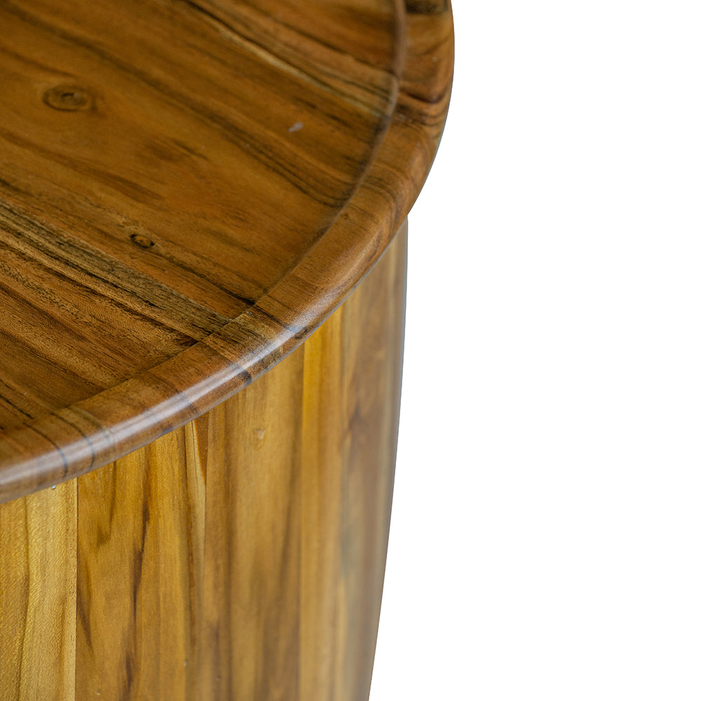 Closeup of a round wooden serving tray with natural wood grain and a curved edge
