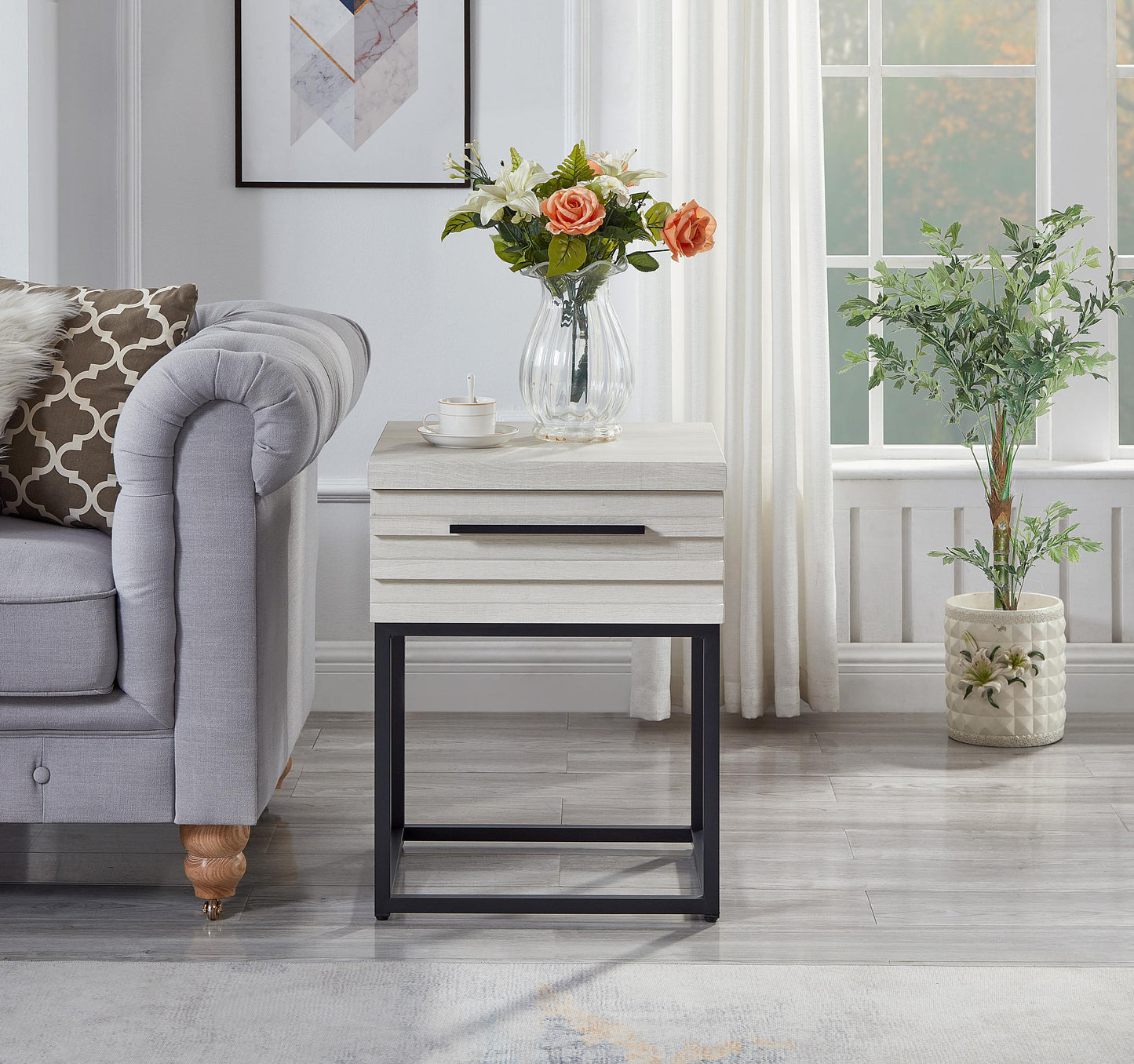 White wood textured end table with black metal frame and a drawer