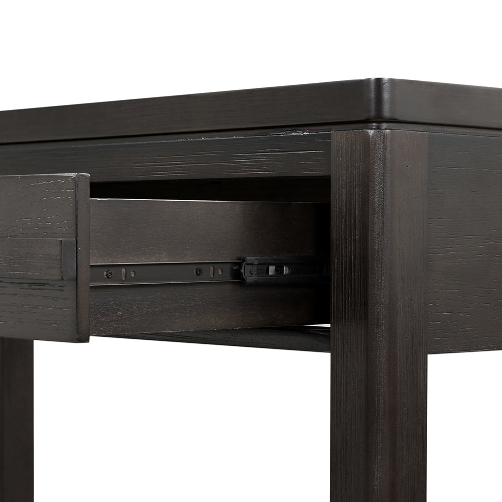 Dark wood desk with partially open drawer and metal slides
