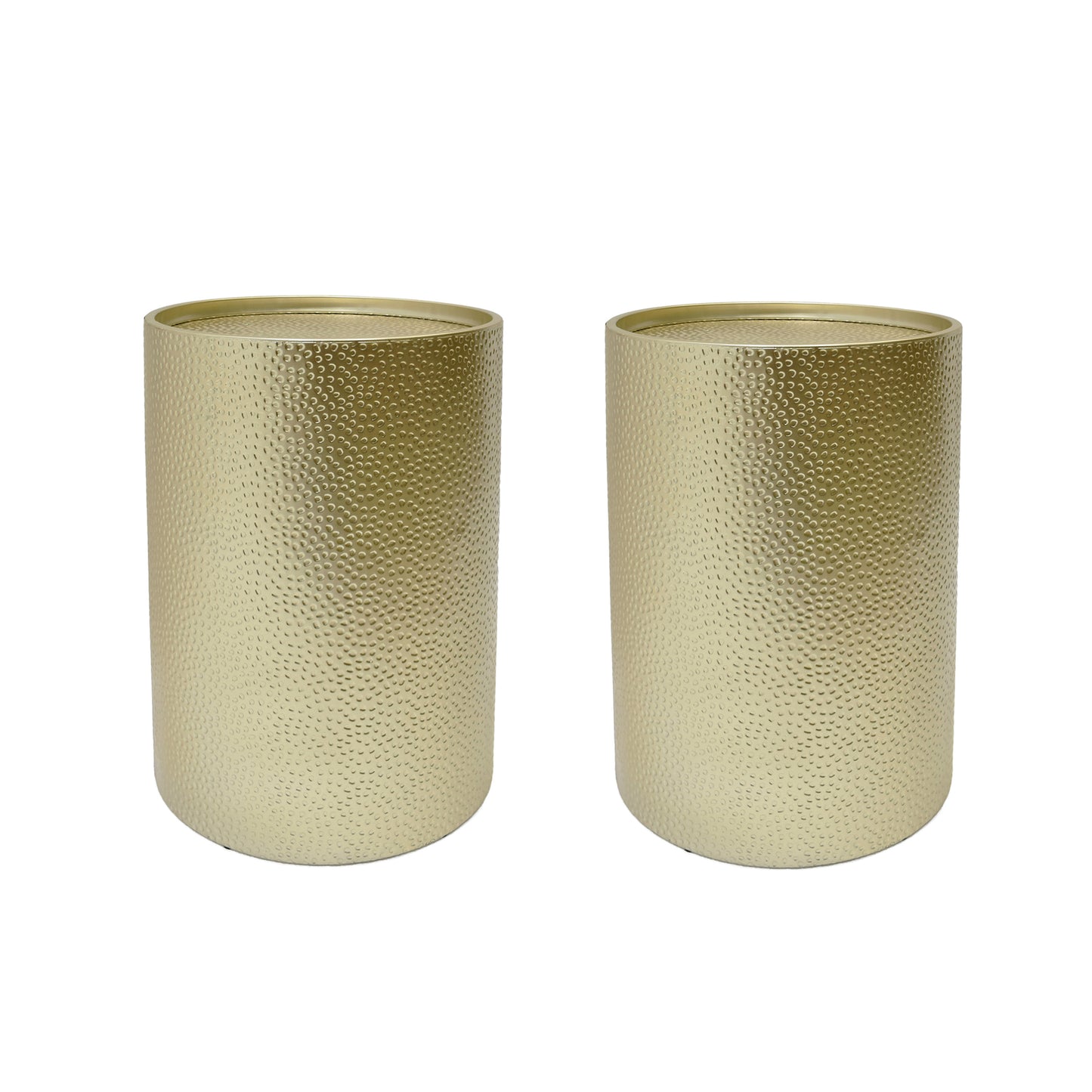Two round hammered gold end tables with a metallic finish