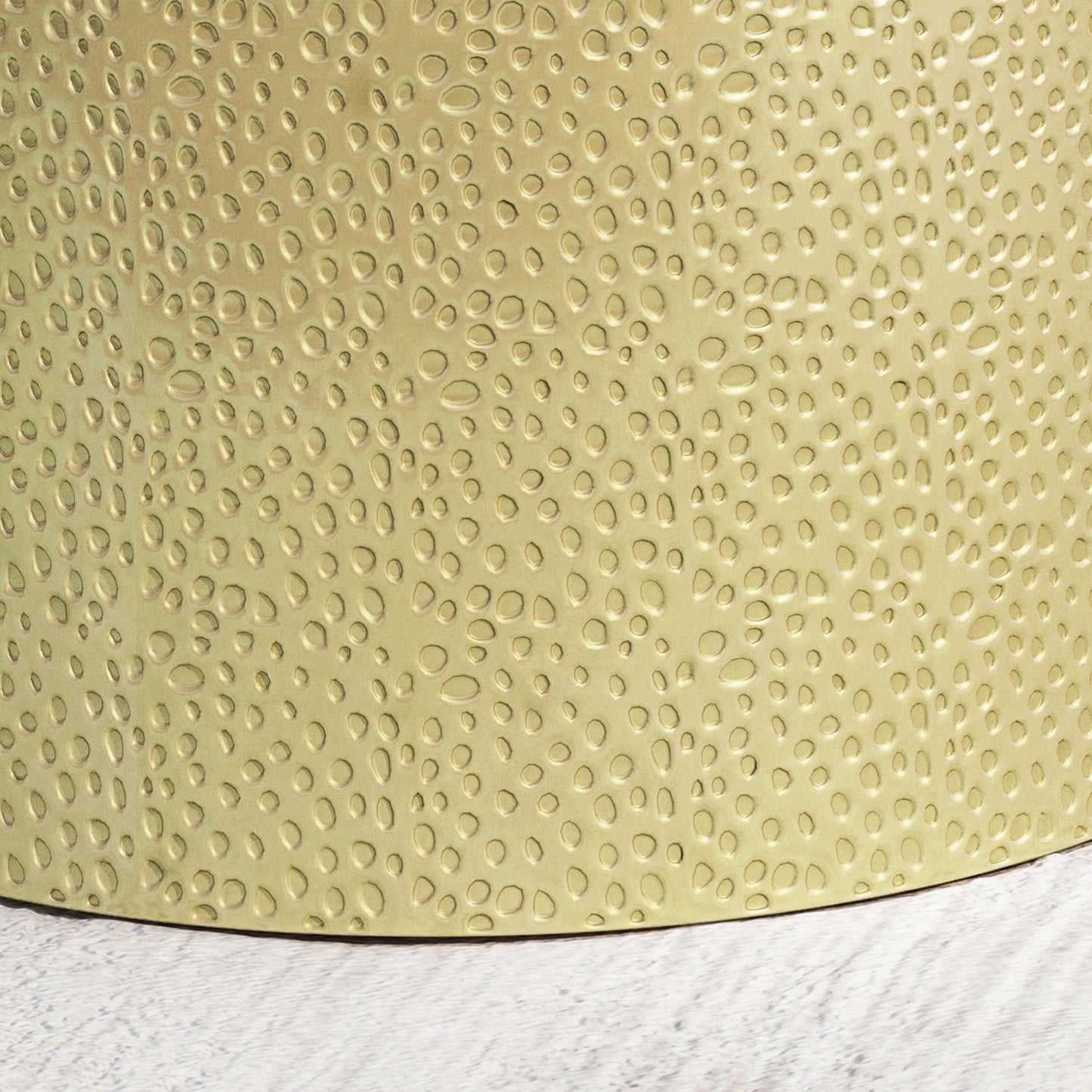 Hammered gold metal planter with textured pebblelike indentations