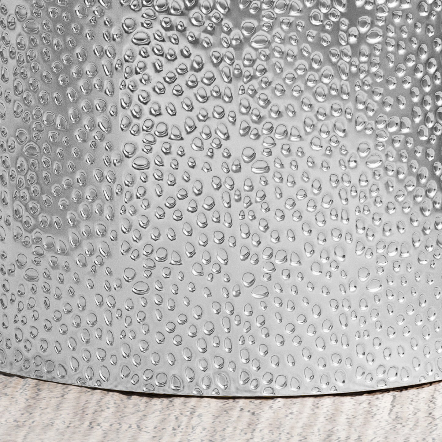 Textured silver metal bowl with a hammered water droplet effect perfect for serving