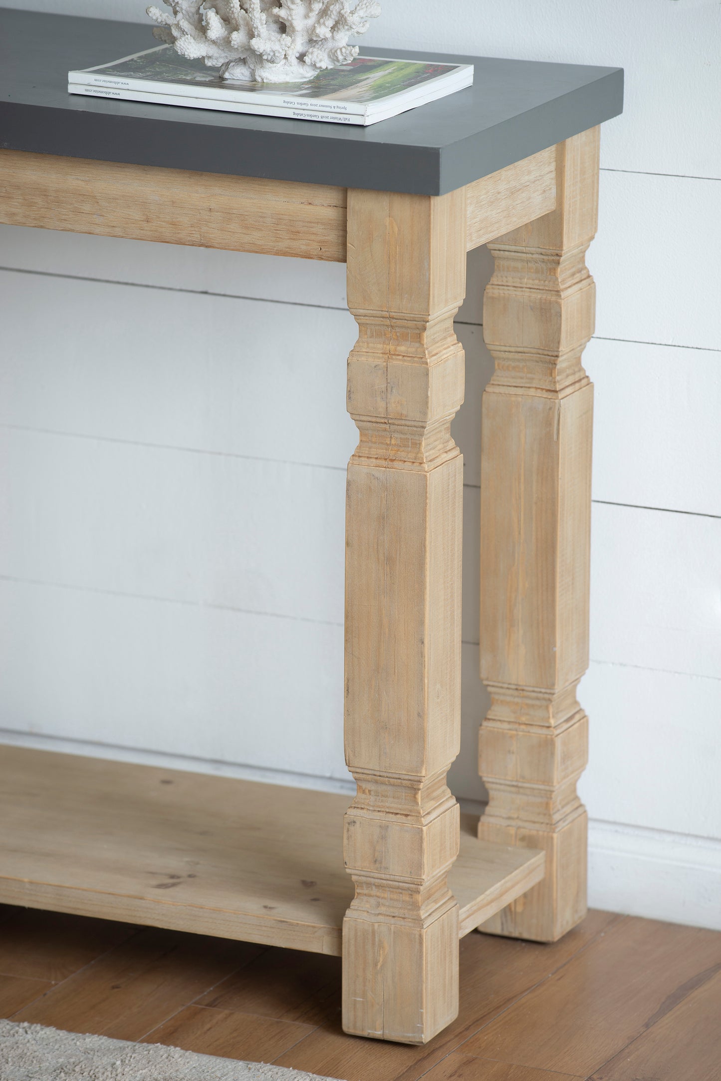 Distressed wood console table with gray top and carved legs