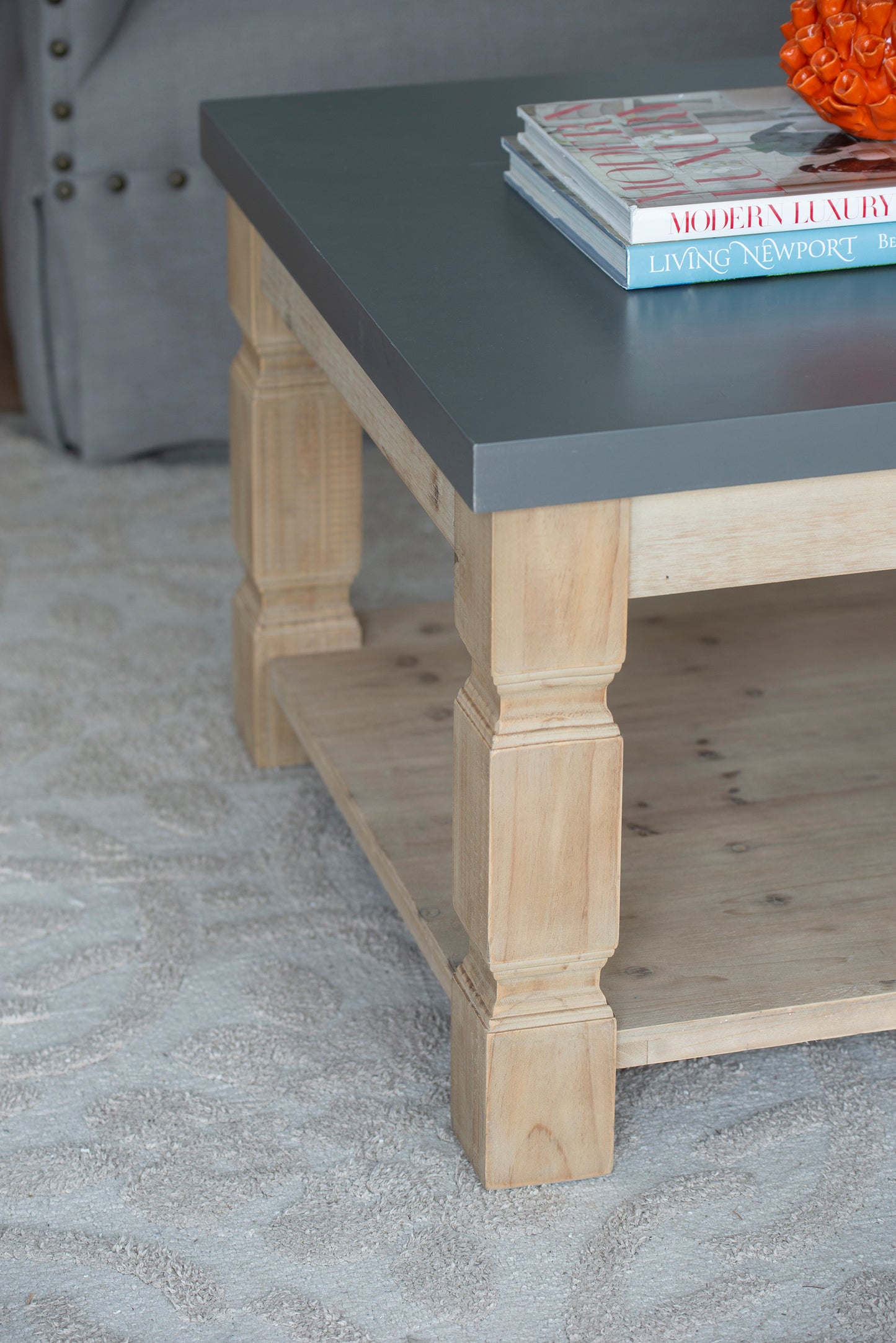 Rustic wood farmhouse coffee table with a twotiered design and gray top