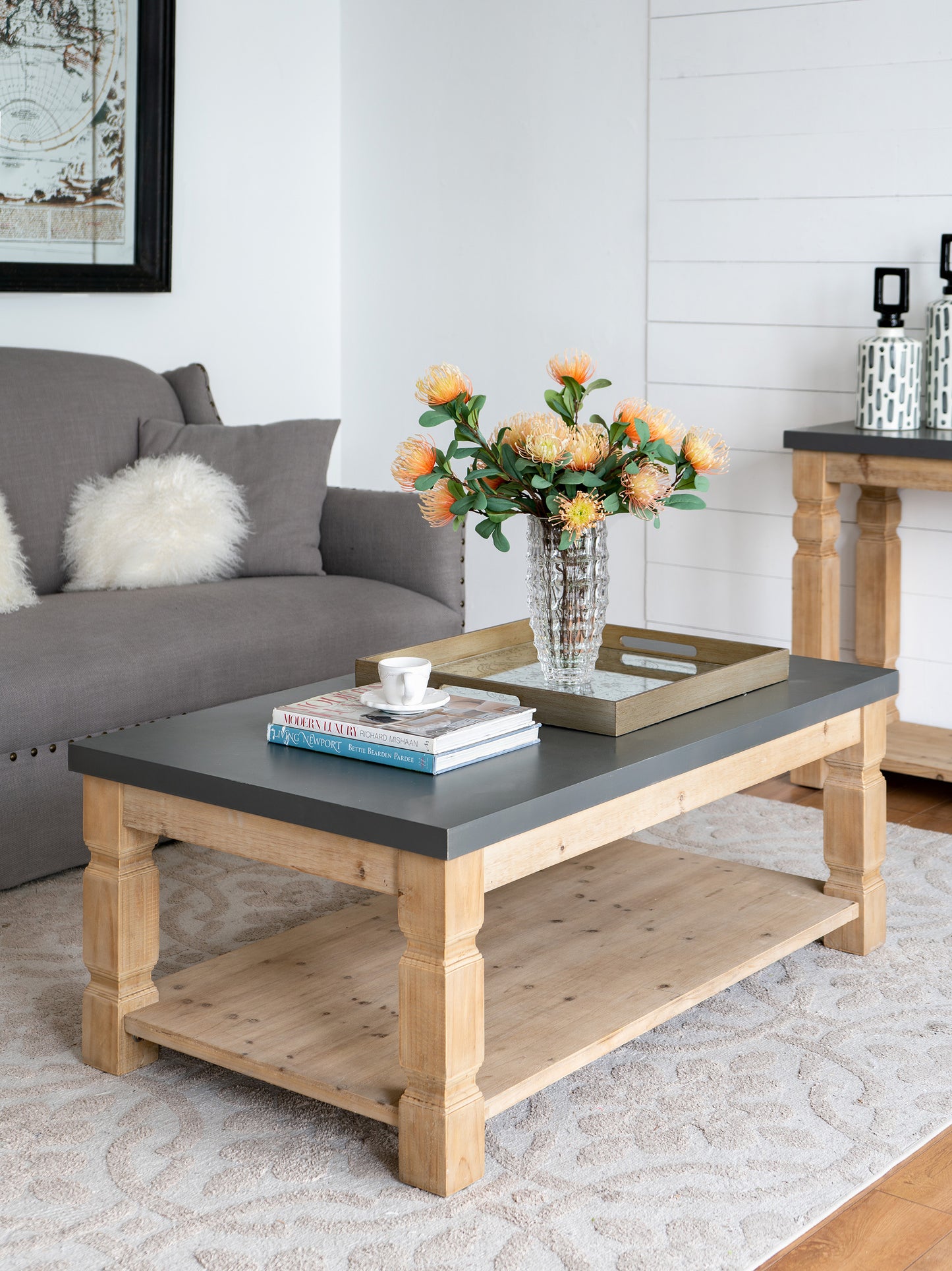 Farmhouse coffee table with natural wood legs and dark gray top