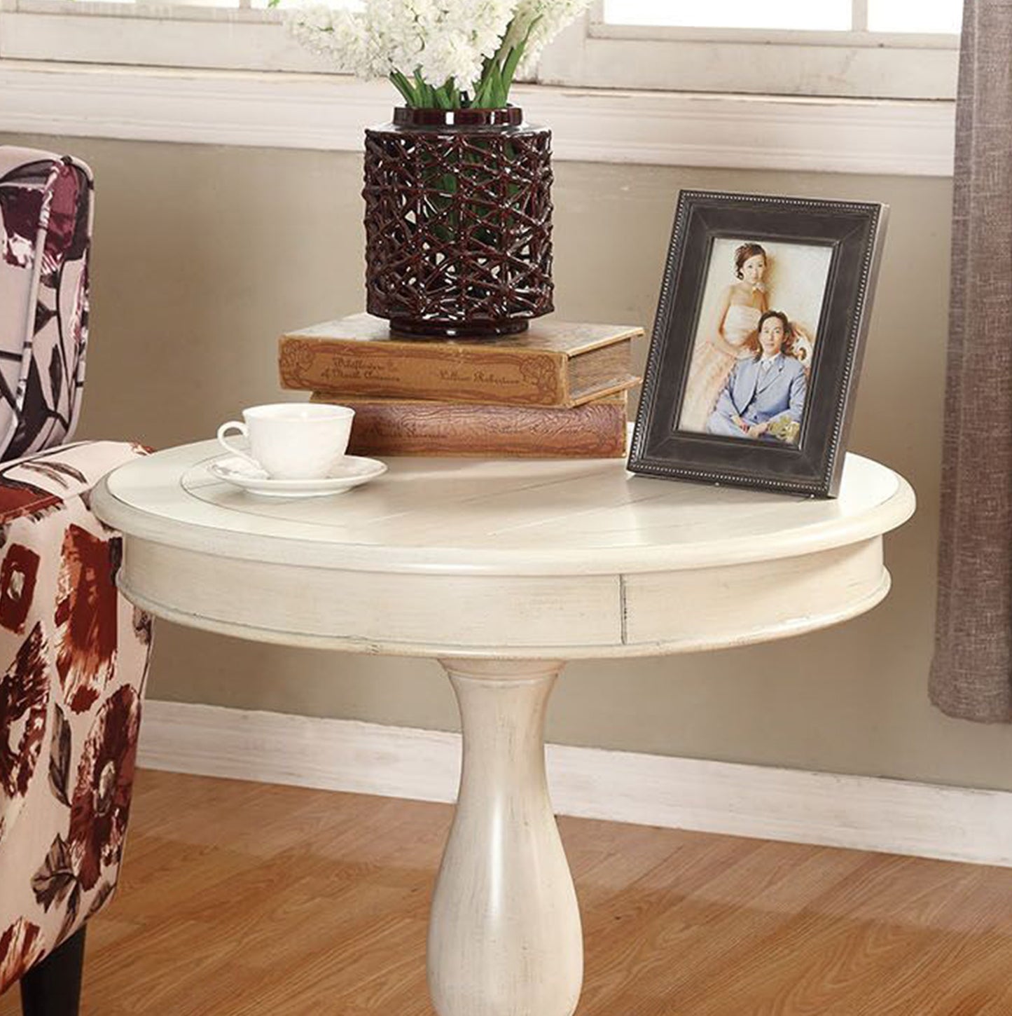 Vintage white round side table with ornate leg and drawer detail