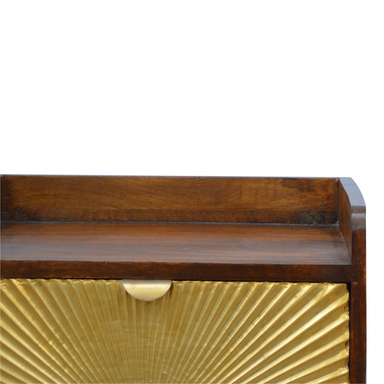 Drawer front of golden fluted accent cabinet with brass pull handle
